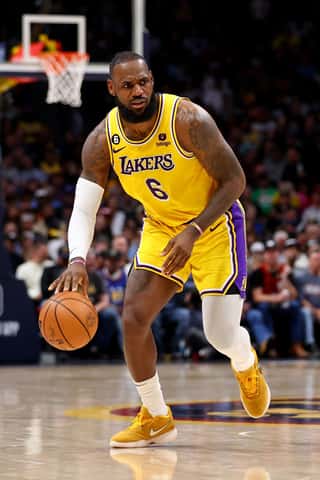 A basketball player executing a powerful dunk, athletic prowess on display